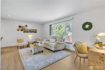 Open concept living room w/lots of light.
