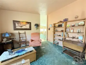 Sitting room headed towards dining area