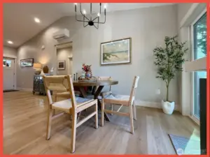 Dining area with door leading to the back deck