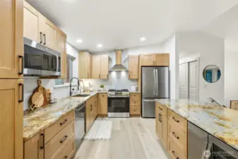 Beautifully updated kitchen with vaulted ceiling, dimmable recessed lighting