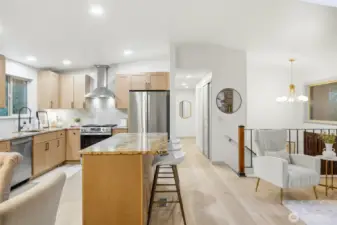 Vaulted ceilings throughout main living area with recessed lighting, new luxury vinyl plank flooring