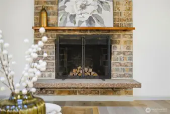 Lovely original brick fireplace on the main floor with custom mantle