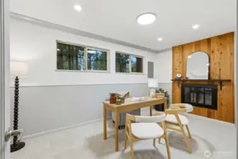 Cozy Bonus Room/Office with wainscotting, wood-burning fireplace and cedar accent wall.