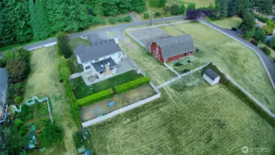 The Pasture behind the Home belongs ONLY to this Shy Acre property. Notice the Large Storage Out Building (with a Loft) in the corner. ALSO..Directly behind the hedge was used as a Dog Run, Batting Cage, Private Storage. The Barn and ITS pasture is to the far Right. Easy access to the Tolt Trail for Riding or Walking from here!