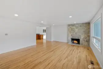 Spacious living room with large windows and natural light