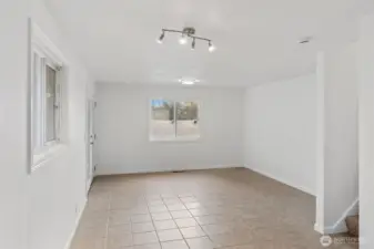 Dining area with steps up to the primary room.