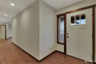 Entryway boasts storage coat closet, a cover front porch, and a utility room that goes directly into the garage.