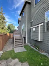 Fully fenced backyard with deck