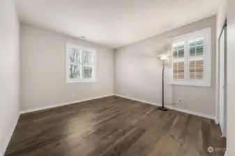 Guest bedroom with custom shutters