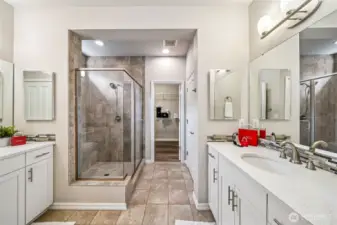 His and Her sinks on opposite walls, custom shower, walk in closet, and two linen closets.