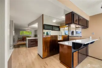 A fully functional wet bar w/ pass through to the kitchen allows for entertaining easy!
