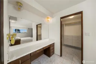 Convenient vanity adjacent to primary walk in closet