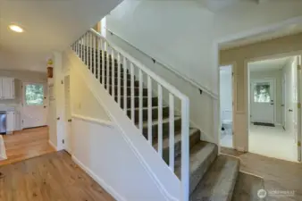 Entry. Stairs up to 2nd floor ... immediately to right is laundry and door to garage. Peek-a-boo here of guest bath. And, to left front is kitchen and door to back yard.