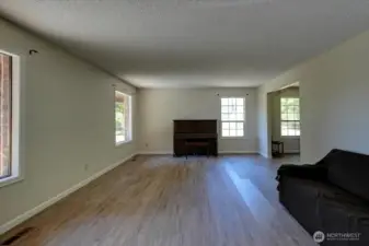 Living room is immediately to left as you enter the front door. New LVP flooring and fresh paint!