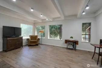 Home is so perfect for entertaining! Large well-planned rooms are framed with windows and views.. New LVP flooring here too!