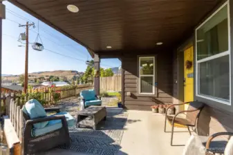 Spacious front porch with stunning mountain views. A perfect spot for morning coffee or evening relaxation.