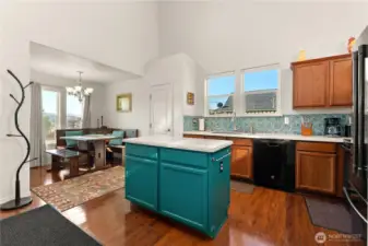 Spacious, open kitchen. A cozy dining nook with plenty of natural light completes this welcoming space.