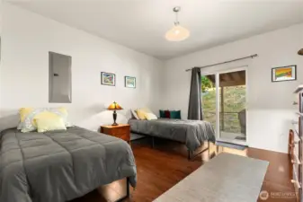 Spacious, main floor bedroom with ensuite and access to the covered back patio and fully fenced back yard.