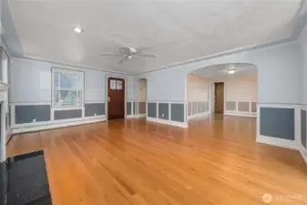 The formal dining room is shown through the archway and beyond that is the kitchen. The sunroom has double french doors and can be accessed from the living room and also the dining room.