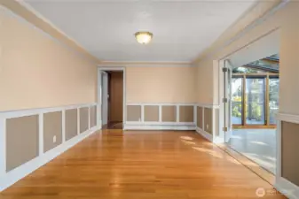 The formal dining room offers plenty of space for a large entertainment-sized table, sideboards and hutches.
