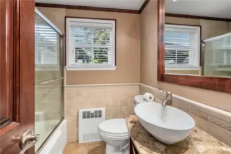 This full bath is on the main floor and serves the two main-floor bedrooms.