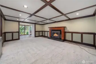 Gorgeous downstairs family room with a cozy gas fireplace. It opens to another room that could be used as a game room, guest space, library, or whatever you wish.