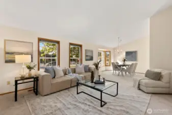 Main living & dining area offers great natural light and vaulted ceilings.