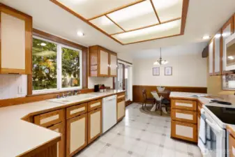 Big window overlooks yard space.