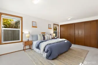Spacious primary bedroom sits at back of house.