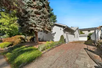 Great space for RV, boat or additional parking along East side of house.
