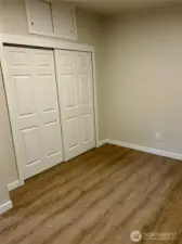 The third bedroom offers plenty of closet space with a light inside. It’s freshly painted and features a newer floor and baseboard.