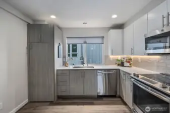 Chef's kitchen with stainless steel appliances.