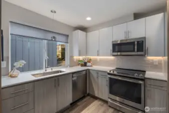 Chef's kitchen with designer finishes and under-cabinet lighting.