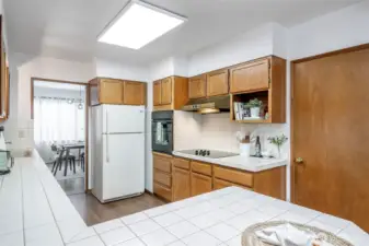 In-counter ceramic cooktop separate from oven insert.