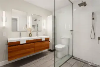 Modern primary bathroom with double sink and heated floors