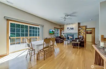 Lots of room to spread out, expand the table.  Or, maybe move the table for some at home dancing?  Easy access to a huge wrap around deck and access to the pool.