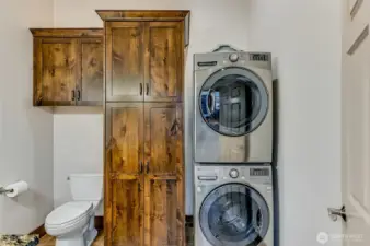 1/2 bath off the kitchen with Washer Dryer that isn't keeping you awake at the sleeping end of the house.