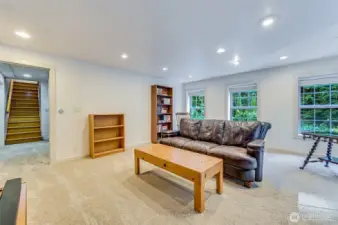 Mil lounge space with three rooms that could be used for sleeping areas.