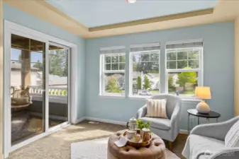Primary suite sitting area with slider to your private deck.
