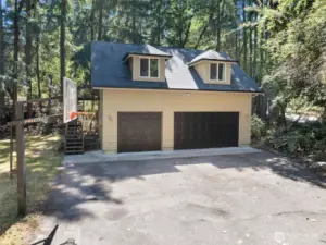 Private road leads to DADU with oversized garage.