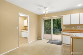 Eat in kitchen dining area with access to deck and mudroom off garage.