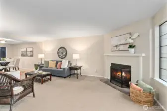 Living room with cozy wood-burning fireplace.
