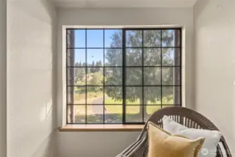 Primary bedroom outlook to 14th Tee of Walter Hall Golf Course.