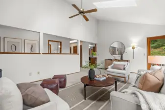 With soaring vaulted ceilings and direct backyard access, the living room combines openness with seamless indoor-outdoor living