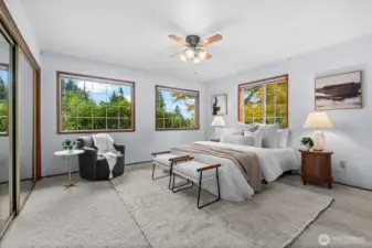 A generously sized ensuite bedroom at the hallway’s end ensures a quiet and private space.