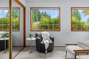 Several windows allow natural light to illuminate the space, creating a bright and welcoming atmosphere.