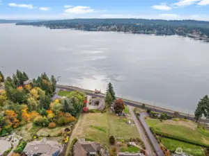 With nearby waters, the home enjoys crisp, refreshing air that enhances every season.