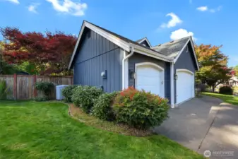 Yard features custom concrete curbing around beds.