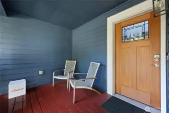 Covered front porch with keypad lock and upgraded 1/4 lite wood door.
