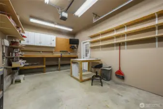 Garage features 3 bays. This 3rd bay was being utilized as a hobby space. Has 2 220V Outlets.